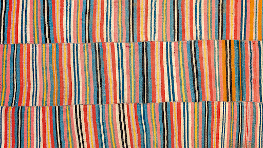 Vibrant Tibetan textile weaving on a traditional loom