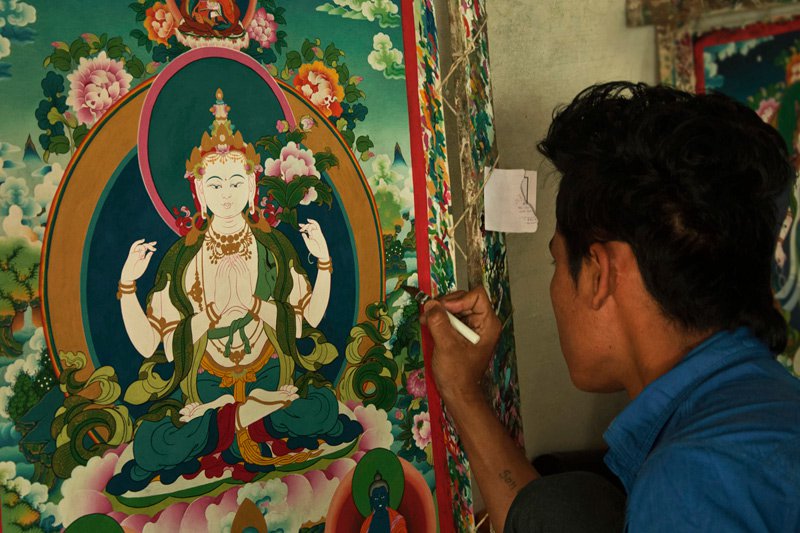 Gold and pigment thangka painting in progress